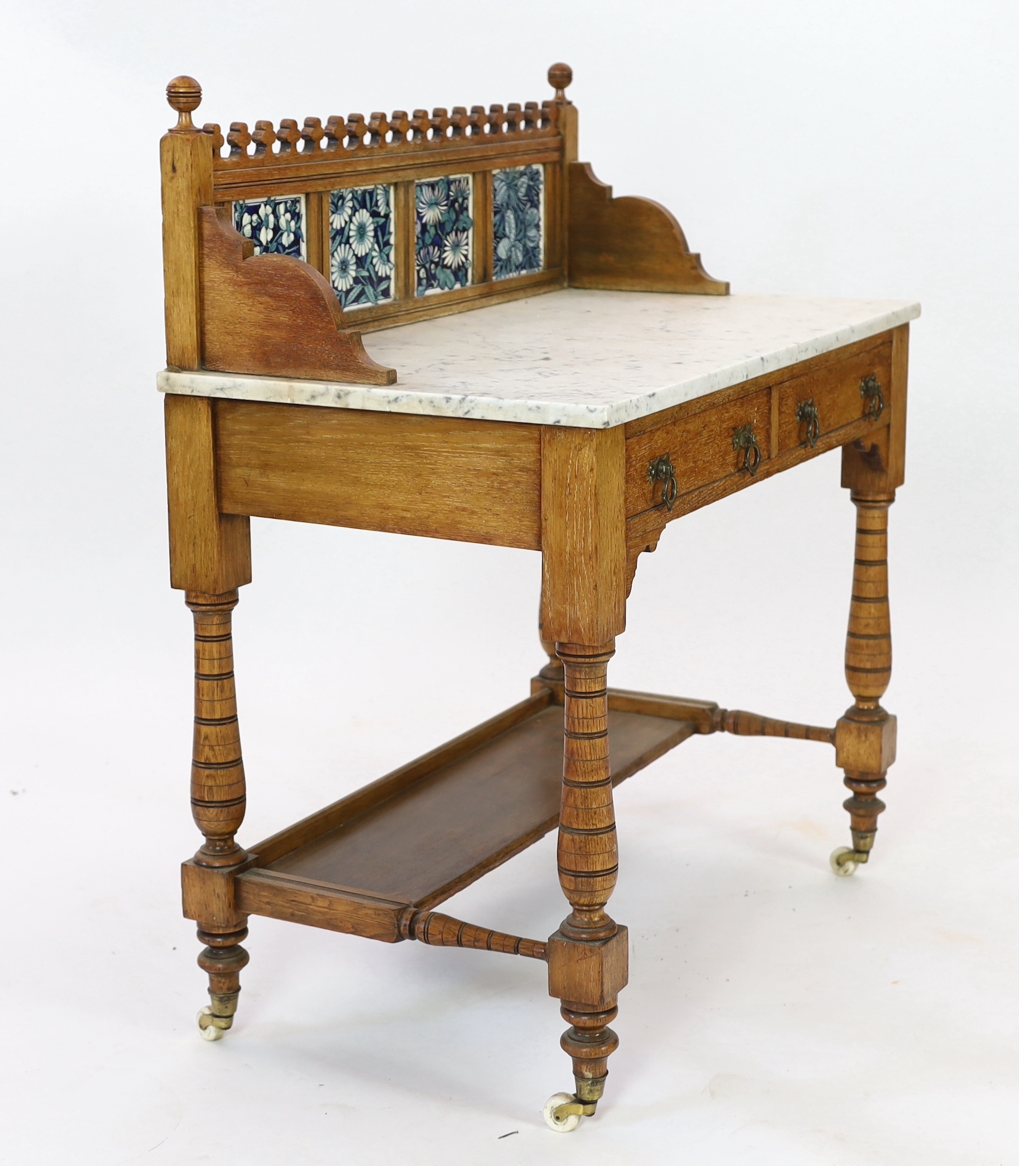 Lewis Foreman Day (1845-1910). A Victorian Aesthetic movement golden oak and marble washstand, width 90cm, depth 51.5cm, height 104cm